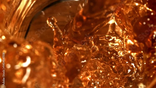 Black tea is poured into a cup. Filmed on a high-speed camera at 1000 fps. High quality FullHD footage