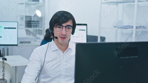Businessman Customer Service Support, Telemarketer working on online advice, consulting, helpline, CRM marketing with headset talking to client or customer online using computer at call center office.
