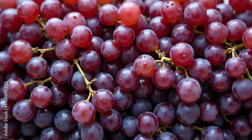 Close-up of fresh, vibrant red and purple grapes. Ideal for food, healthy eating, or agriculture themes. High-quality image for diverse applications.