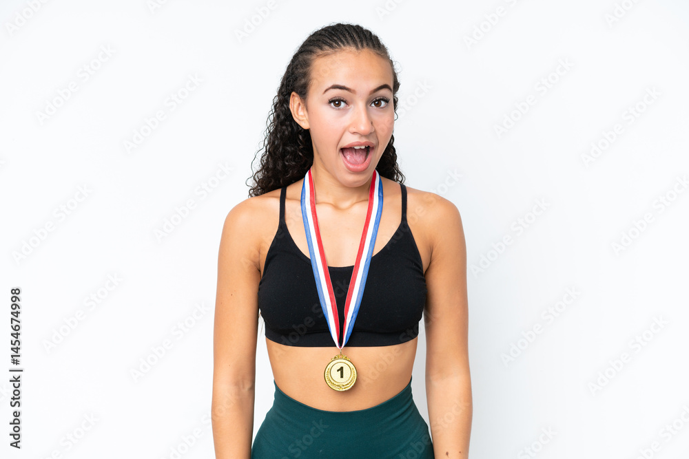 Young sport woman with medals isolated on white background with surprise facial expression Young sport woman with medals isolated on white background with surprise facial expression