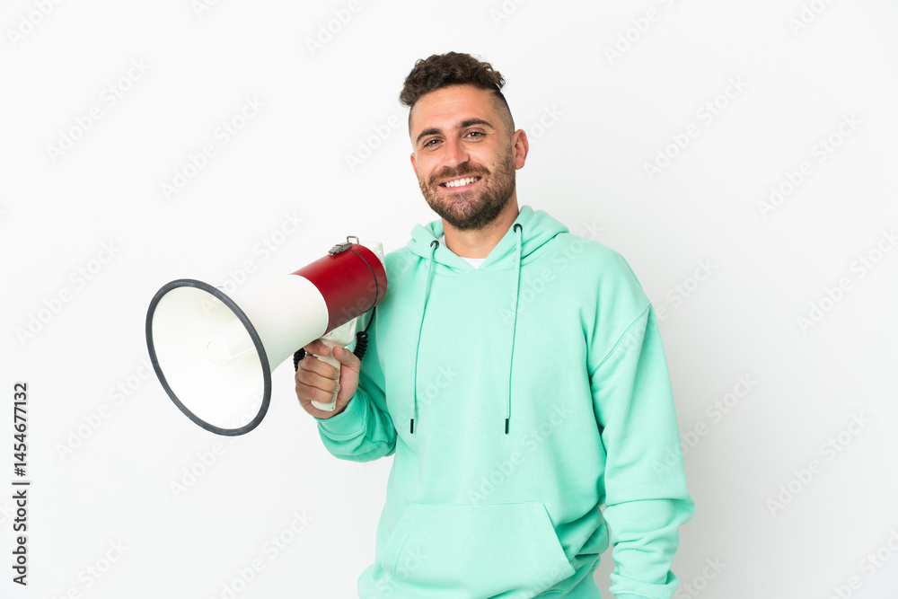 Caucasian man isolated on white background holding a megaphone and smiling a lot Caucasian man isolated on white background holding a megaphone and smiling a lot