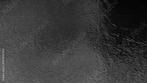 black textured nylon fabric background with reflective sheen for web design, print materials, branding mockups, or digital surface pattern resources

