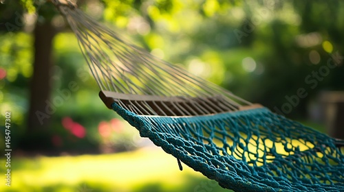 Obraz na płótnie Hammock strings tangled artistically, soft bokeh in background showing garden trees and flowers w salonie