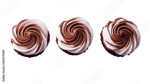 Three cupcakes with swirled chocolate and white frosting isolated on a white background