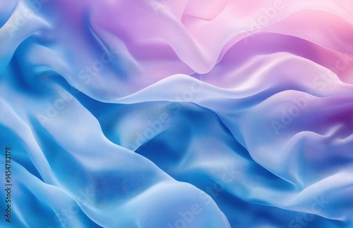 Top view of flowing blue silk fabric with wavy texture, creating an abstract background ideal for fashion design and product decoration.