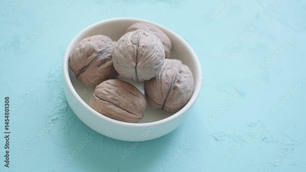 walnuts in a brown coconut bowl close up