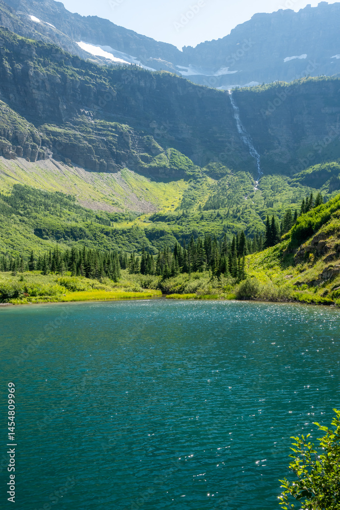 Waterfall Flows from Dixon Glacier into Lake Frances