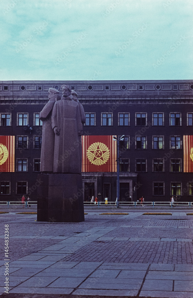 Latvian Riflemen Monument and Soviet-Era Building in Riga