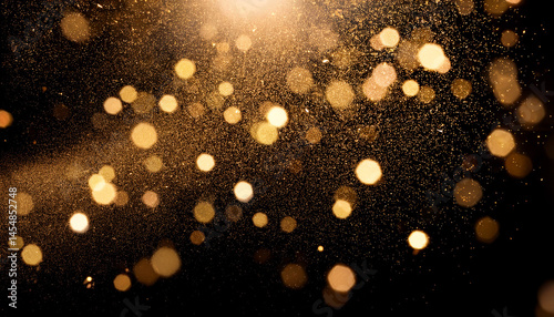 golden dust and glitter bokeh particles effect against black background shimmering gold lights abstract overlay