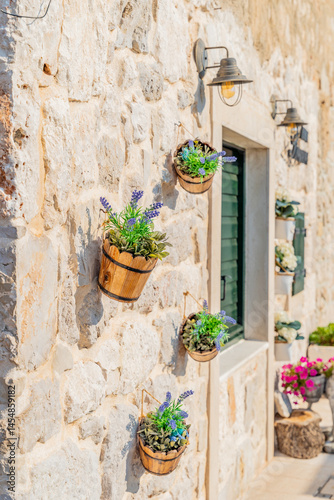 old mediterranean house with lavender flowers in the pot