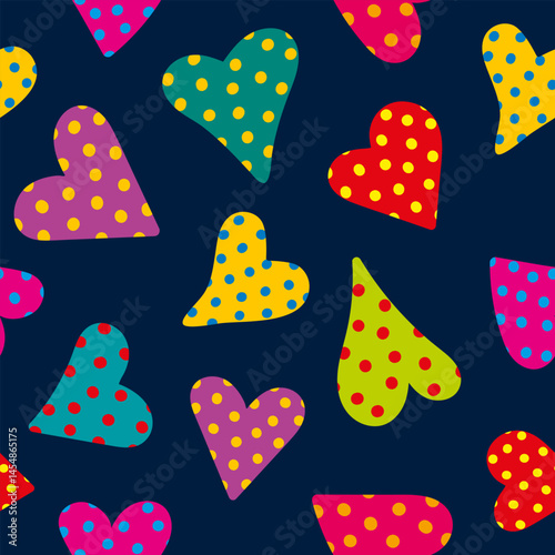 seamless vector pattern of colorful polka dot hearts on dark blue background, fun and vibrant love design for valentine's day romantic themes, repeating texture