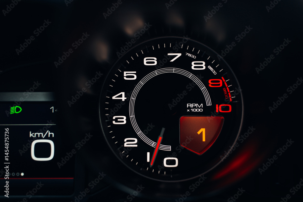 Modern car close up view of tachometer and speedometer carbon dashboard with backlight Modern car close up view of tachometer and speedometer carbon dashboard with backlight