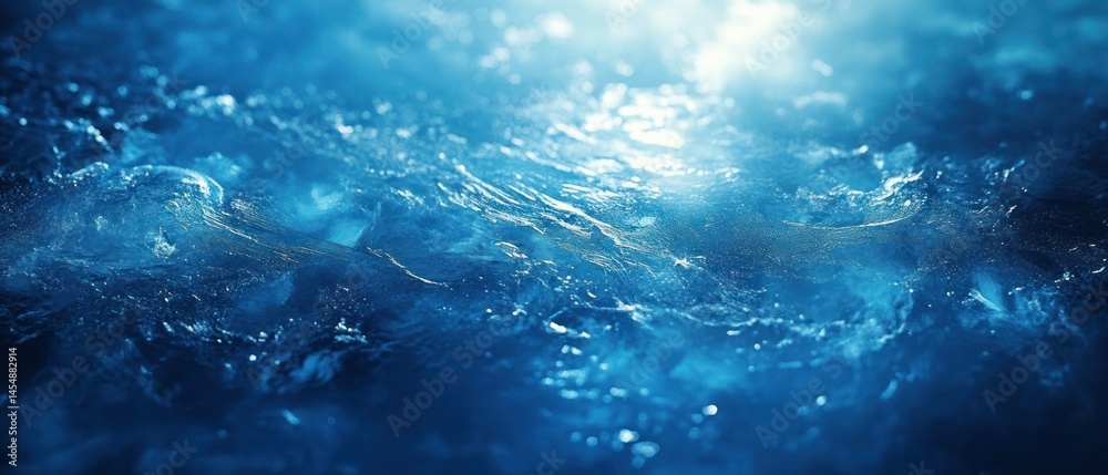 Obraz premium Water waves ripple, reflecting light and creating a dynamic, turbulent surface.