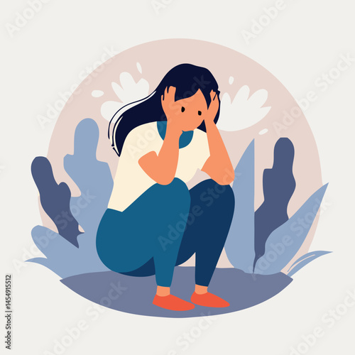 Anxious woman with dark hair sits with her head in her hands expressing sadness