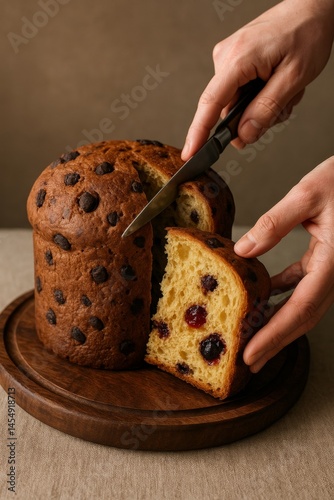 Chocolate Chip Bread Being Sliced on a Wooden Board in a Bright Kitchen Setting