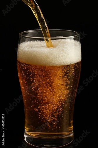 Pouring Refreshing Golden Beer Into a Chilled Glass With Bubbles Forming