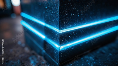 Artistic shot of bank corner column featuring striking neon blue stripes and subtle micro particles in a dark bokeh background