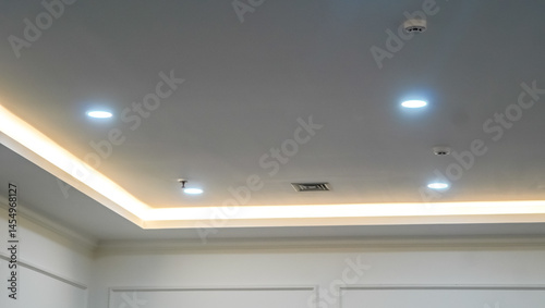 Modern interior design featuring recessed lighting and subtle architectural details