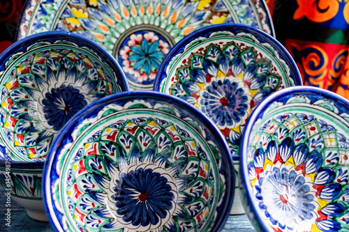 Oriental traditional Ceramic Pyals with national ornaments in Asian market.
