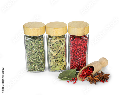 Many different aromatic spices in jars isolated on white