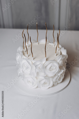 Sweet fresh cake with candles on it. Beautiful exclusive cake with protein cream. Candles on the cake. Birthday dessert