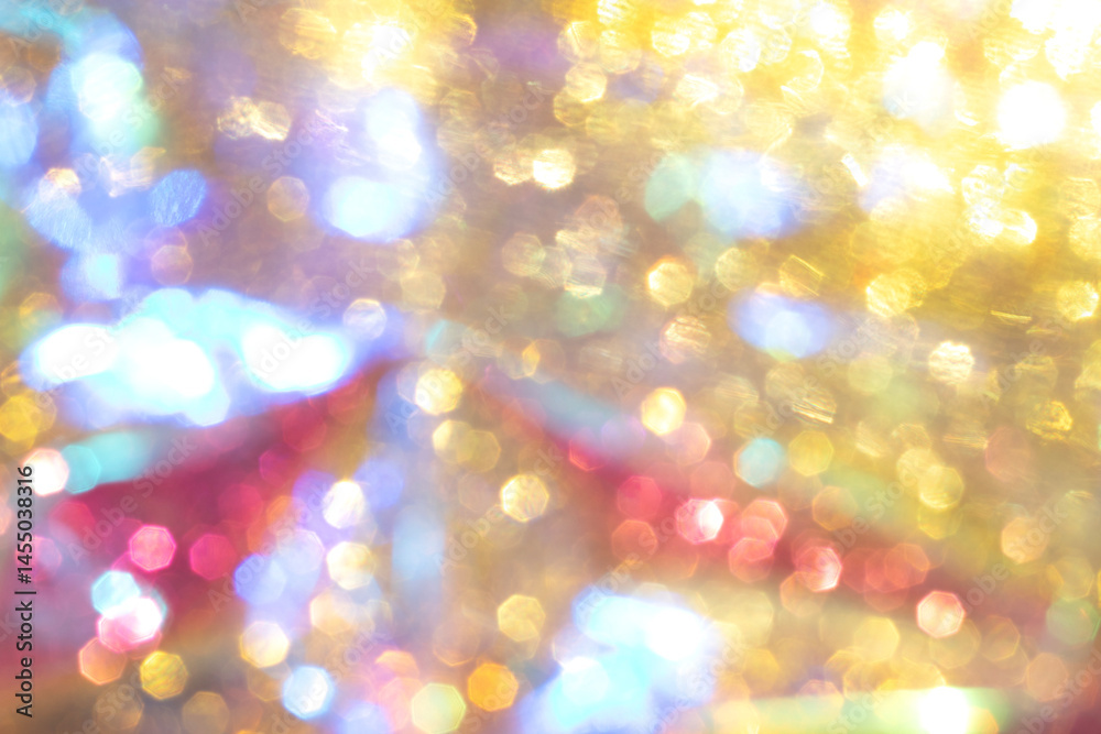Colorful abstract bokeh with yellow, blue, and red shimmering lights Colorful abstract bokeh with yellow, blue, and red shimmering lights
