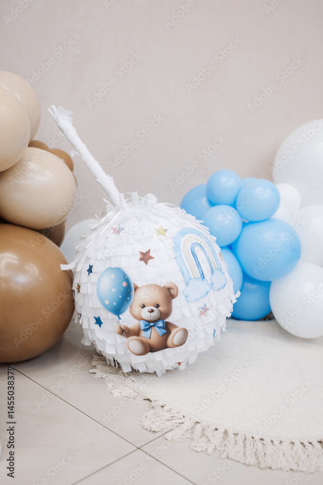 Large photo zone for a children's birthday party with helium white balloons. Bright celebration of a children's birthday party with blue balloons.