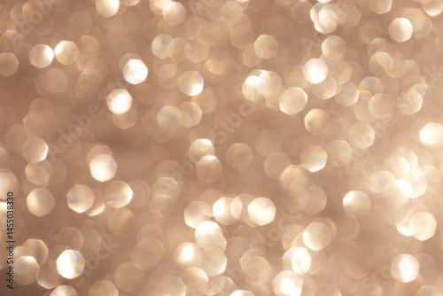 Golden bokeh background with soft glowing light and dreamy atmosphere
