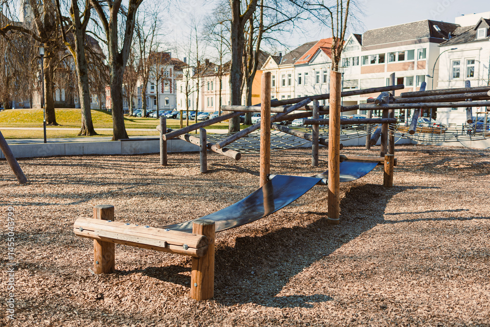 Urban playground with a slide in the open air. Wooden playground.