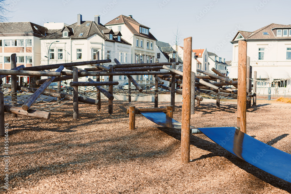 Urban playground with a slide in the open air. Wooden playground.