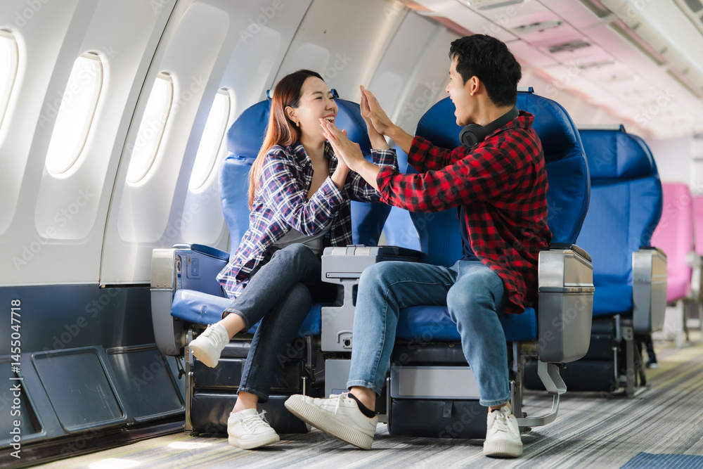 Couple Celebrating on Airplane Flight