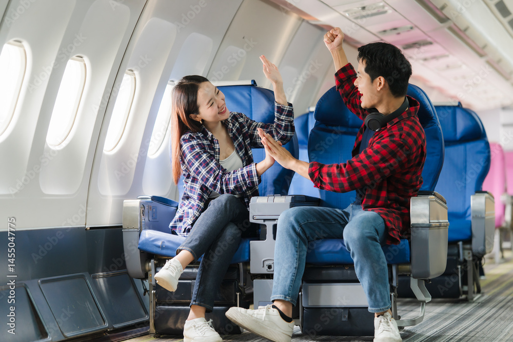 Couple Celebrating on Airplane Flight