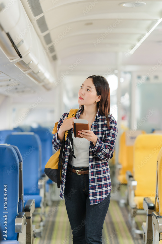Young Woman Traveling by Airplane