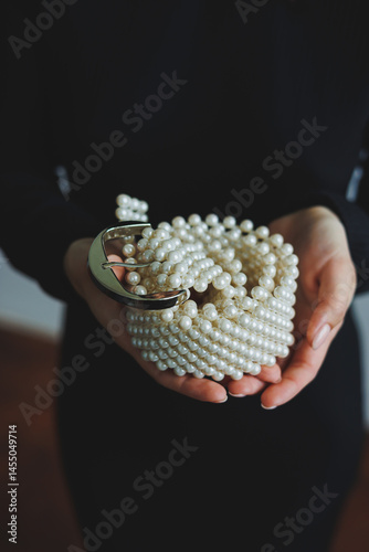 Obraz na płótnie Exquisite pearl belt for an elegant look. Women's pearl belt. Stylish women's accessories. w salonie