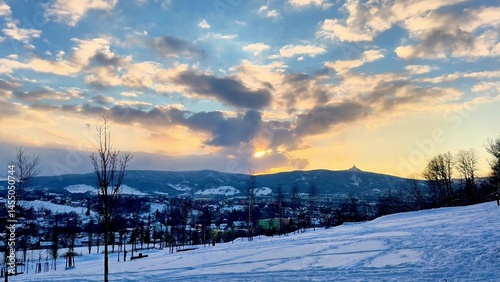 Bild auf Leinwand A Beautiful Winter Sunset painting the sky over a serene Snowy Landscape, truly