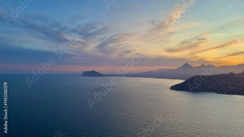 Bild auf Leinwand A breathtaking coastal sunset illuminates the serene waters, creating a magical