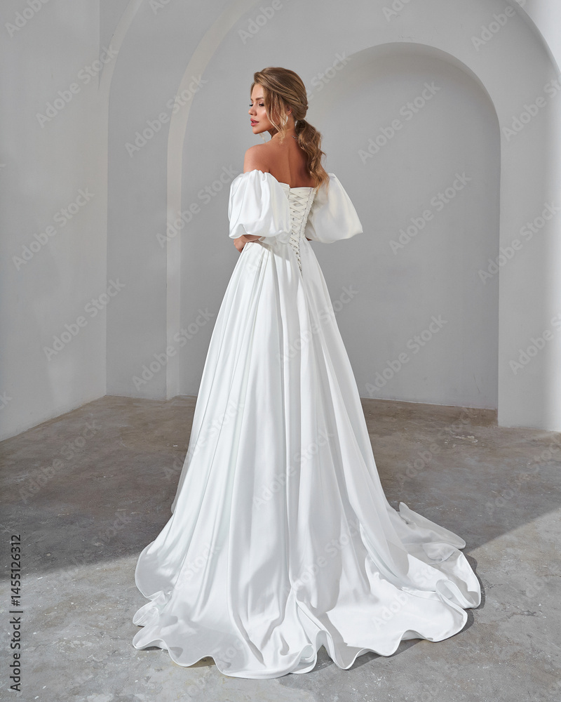 Fototapeta premium Elegant Woman in White Wedding Dress