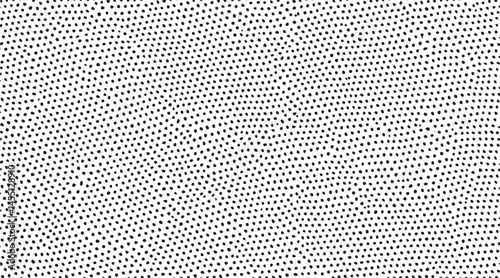A stark monochrome expanse of densely packed circular dots creates a captivating visual texture.