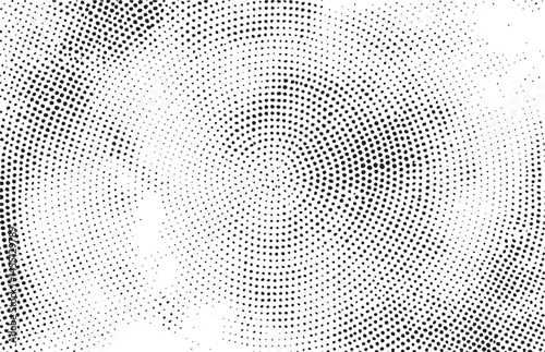 A dense circular of numerous small dots radiates outward from a central point.