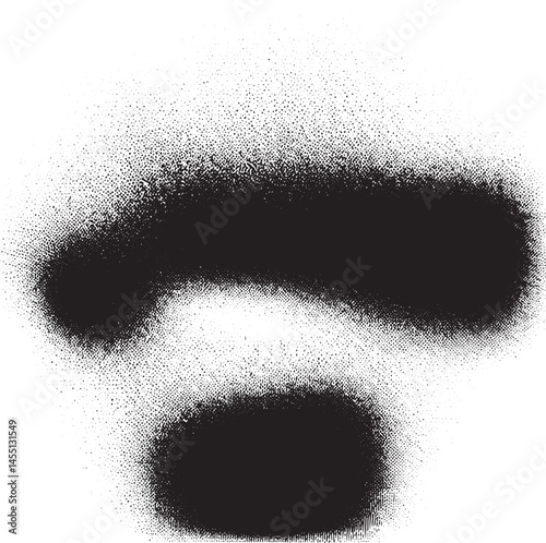 Two distinct black question marks are created with a spray paint effect on a white background.