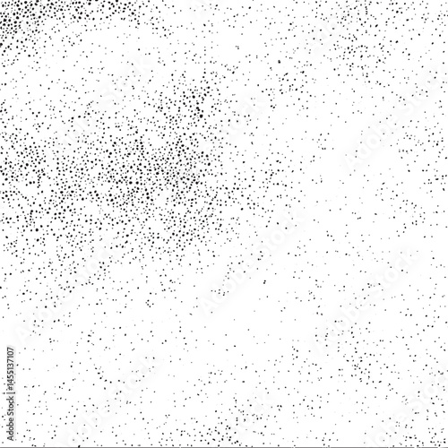 A dense scatter of tiny dark dots covers a white background.