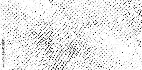A dense textured field of scattered white dots covers a dark background.