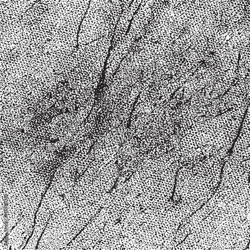 A textured grayscale surface displays numerous intersecting lines.