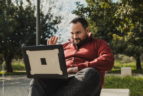 Man With His Pc At The Park Working Hard 