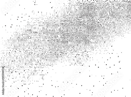A densely patterned surface of small scattered dots creates a dynamic visual texture.