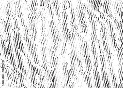 A dense of small white dots contrasts against a black background.