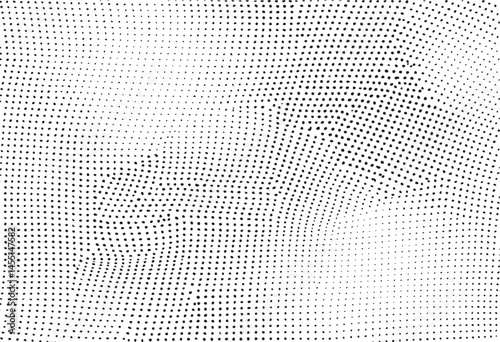 A densely patterned monochrome surface exhibits a dynamic ripple effect.