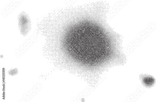 A textured speckled of white dots emerges from a dark background.