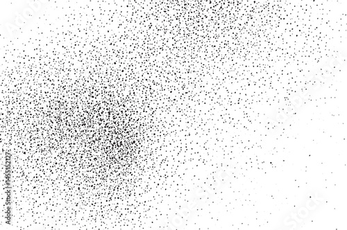 A dense scattering of tiny black dots covers a bright white expanse.