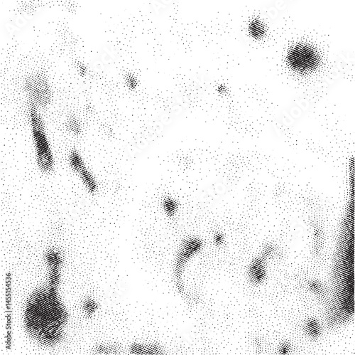 A collection of scattered dark dots against a white background.